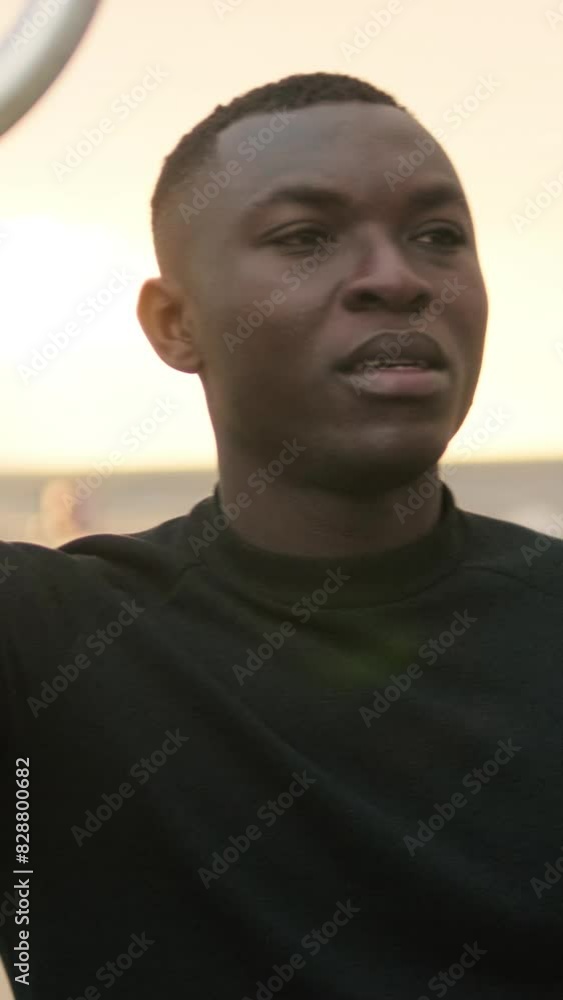 An athlete speaks on the sports field looking into the camera An athlete speaks on the sports field looking into the camera