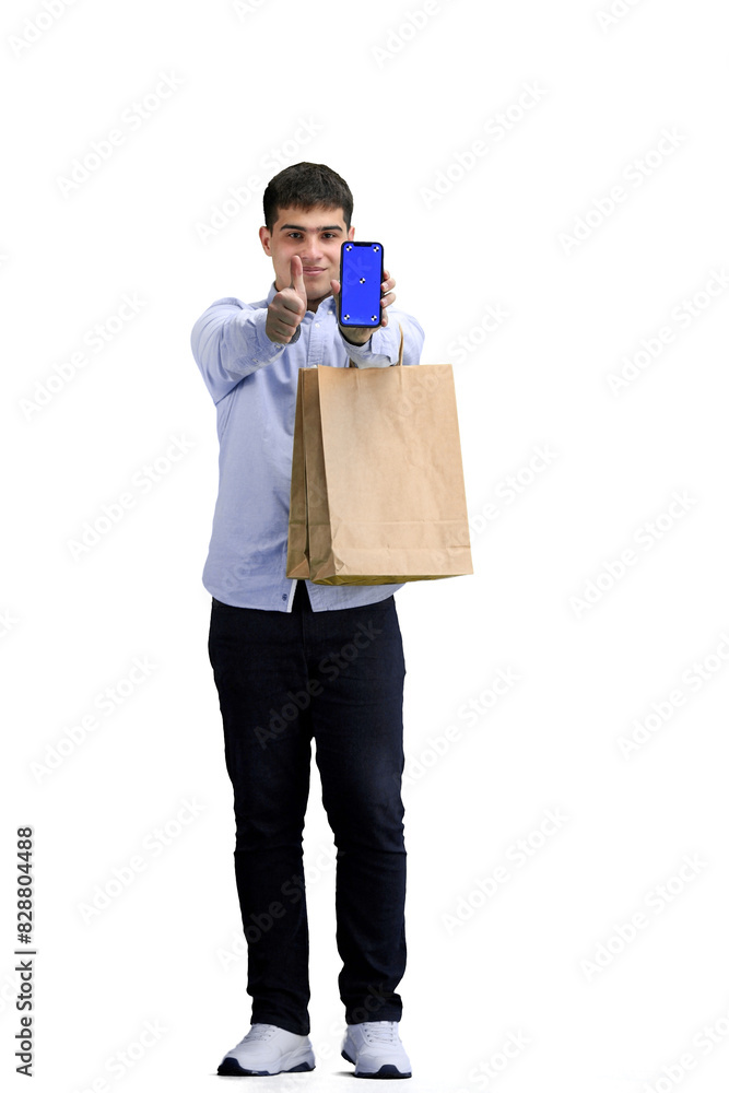 A man, full-length, on a white background, with bags and a phone A man, full-length, on a white background, with bags and a phone