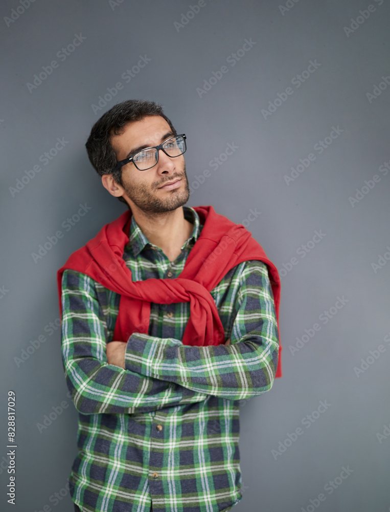 Fototapeta premium Stylish young man posing in the studio on gray background