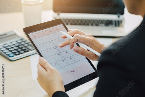 Businessman checking calender planner schedule organization management remind on tablet. Concept of timetable agenda plan for work life balance.