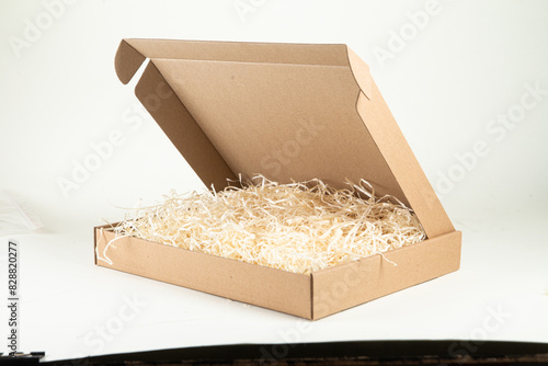 Cardboard box with wood filling on a white background