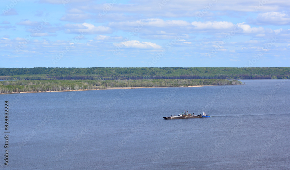 a ship is in the water with an island on the background a ship is in the water with an island on the background