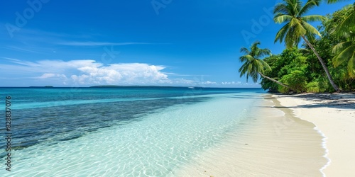 A beautiful tropical beach with blue sky  clear water  and lush palm trees Ideal for vacation and travel themes
