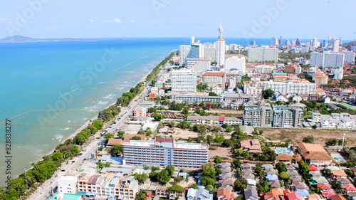Obraz na plátně Aerial view of coastal city with highrise buildings and beachfront, creating urb