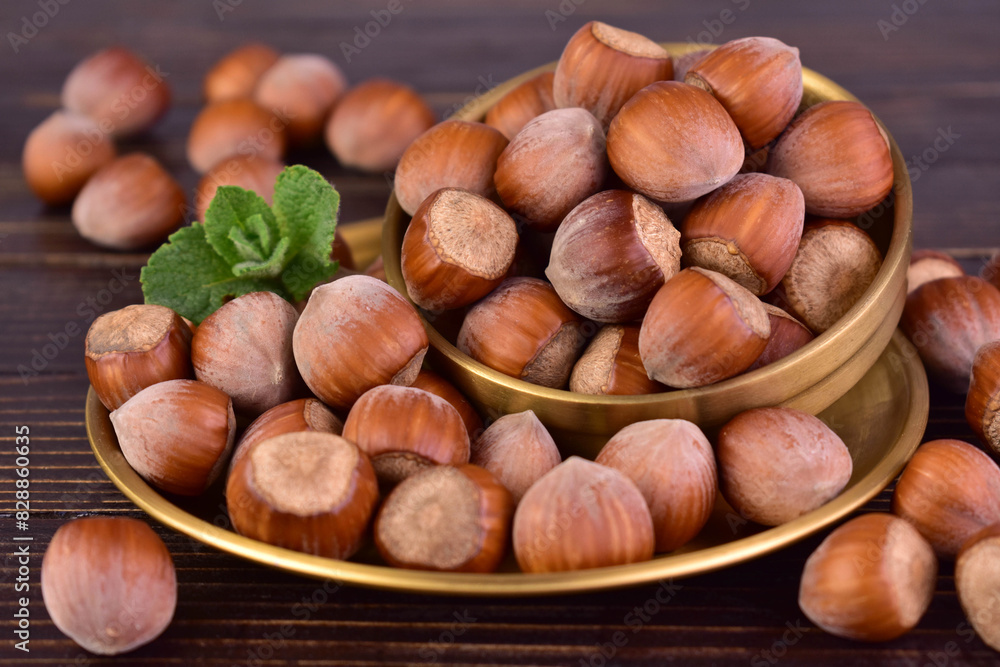 Hazelnuts on a dark wooden background.Close-up.
Hazelnuts on a dark wooden background.Close-up.