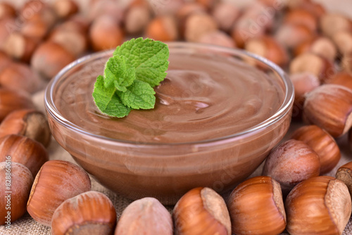 Chocolate spread with hazelnut flavor in a glass bowl. Close-up.