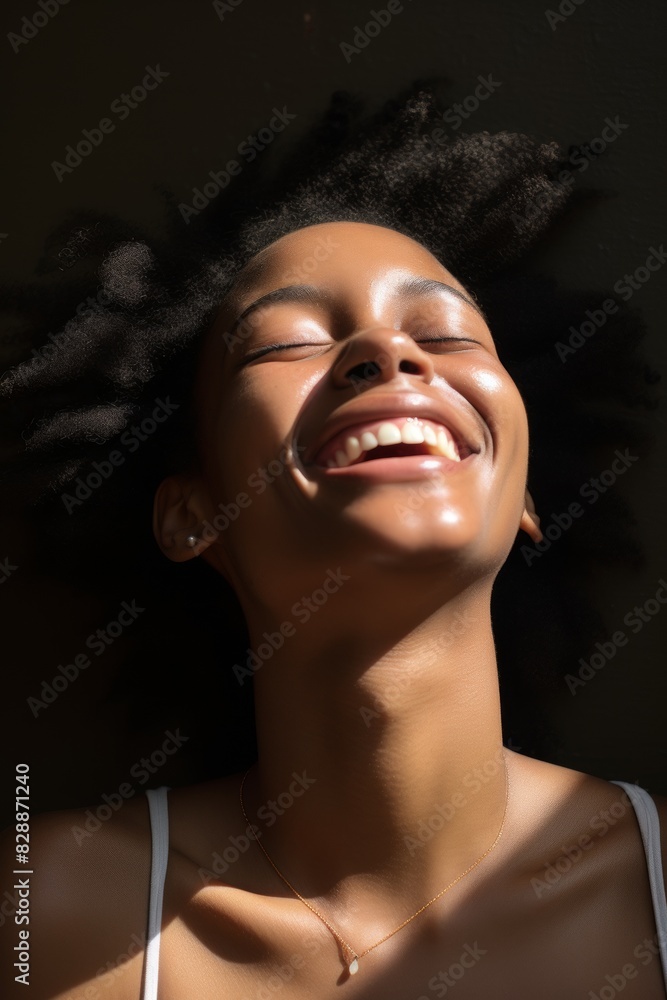 Close-up portrait of an African-American girl against a wall, laughing with her head thrown back, happy. Generative AI. Close-up portrait of an African-American girl against a wall, laughing with her head thrown back, happy. Generative AI.