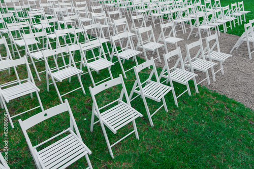 chair ranks outside in garden for some outdoor open air event