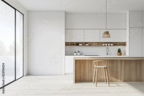 A minimalist white kitchen featuring light wood cabinets, white walls, an airy feel, and designed in the Scandinavian style. 