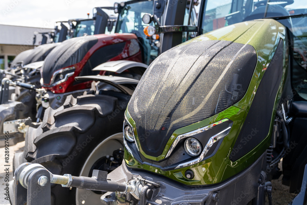 Fototapeta premium Agricultural tractors for sale in a row.