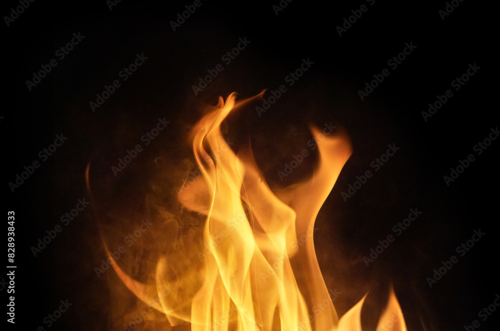 orange hot fire sparks in smoke isolated on black orange hot fire sparks in smoke isolated on black