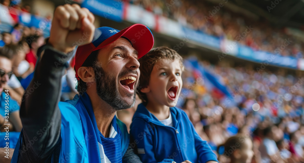 A man and a boy are watching a sports game A man and a boy are watching a sports game
