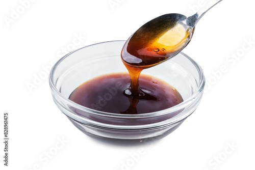 Teriyaki sauce in a bowl on a white isolated background