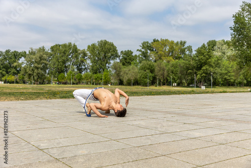 Teenager practicing capoeira , brazilian martial art