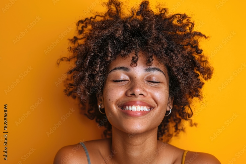 People Enjoying Music. Happy Woman in Wireless Earphones Smiling Against Yellow Background People Enjoying Music. Happy Woman in Wireless Earphones Smiling Against Yellow Background