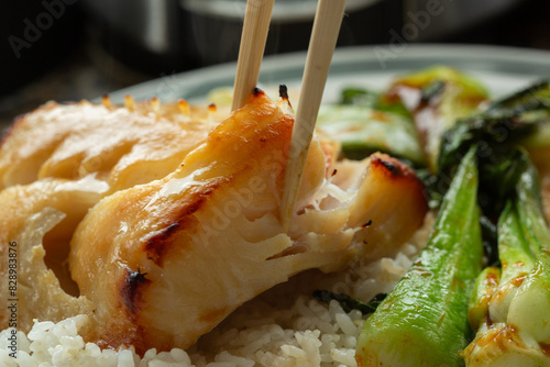 Eating miso glazed broiled black cod butterfish