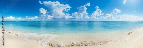 Panoramic view of a serene tropical beach with clear blue water under a sunny sky with fluffy clouds