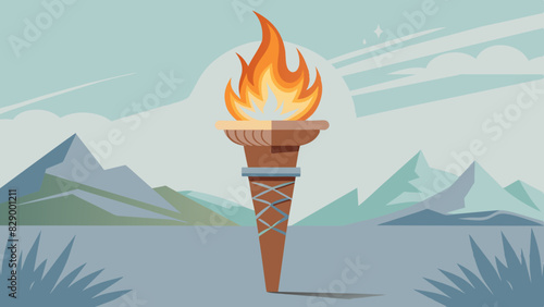 A torch with a burning flame in a mountainous setting.