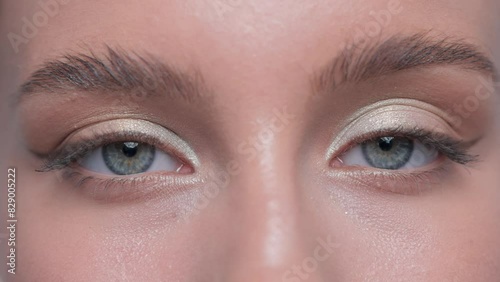 Beautiful woman with long eyelashes, beautiful make-up and thick eyebrows. Professional makeup and cosmetology skin care.