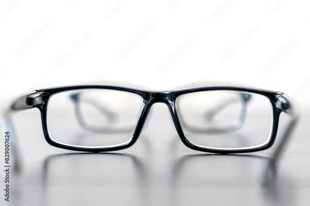 Fototapeta premium Close-up photo of sight eyeglasses is on the wooden table