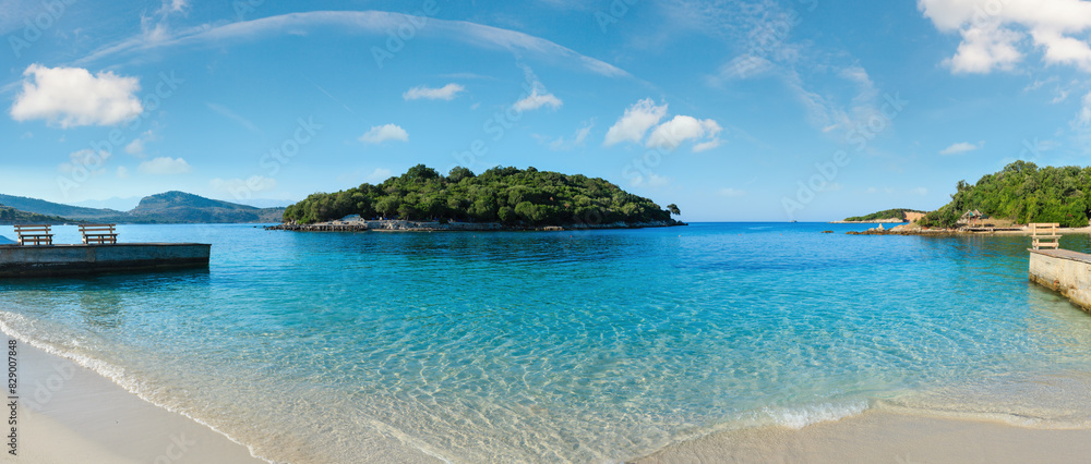 Beautiful Ionian Sea with clear turquoise water and morning summer coast. View from Ksamil beach, Albania.Three shots stitch panorama. Beautiful Ionian Sea with clear turquoise water and morning summer coast. View from Ksamil beach, Albania.Three shots stitch panorama.