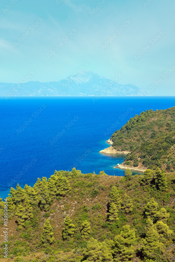 Aegean sea coast landscape and Mount Athos in mist (Chalkidiki, Greece). Three shots stitch image.