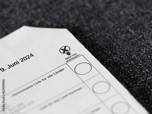 Bitte hier ankreuzen (mark with a cross) on a German ballot paper of the European election 2024. Postal voting in Germany.