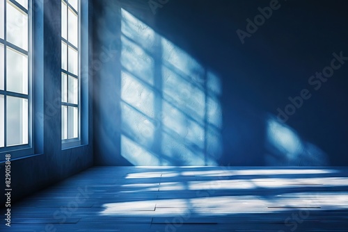 Blue studio room with window shadows for product presentation.