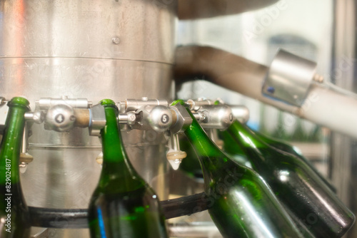 Tablou pe pânză Champagne bottle just before disgorgement and filling with the dosage in de cell