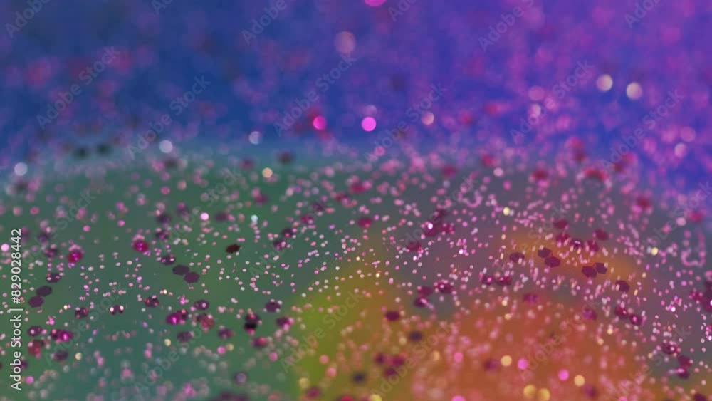 Glitter wave. Bokeh sparkles texture. Blur neon pink blue color shimmering sequin particles translucent liquid flow abstract art background. Glitter wave. Bokeh sparkles texture. Blur neon pink blue color shimmering sequin particles translucent liquid flow abstract art background.