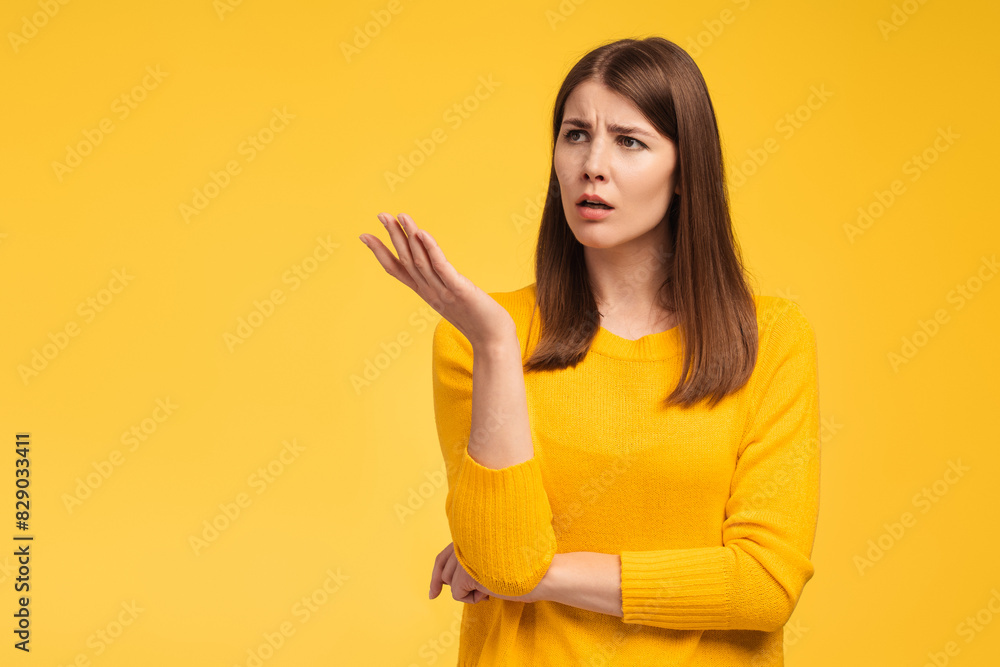 Serious sad middle aged woman looking away on copy space, misunderstanding Serious sad middle aged woman looking away on copy space, misunderstanding