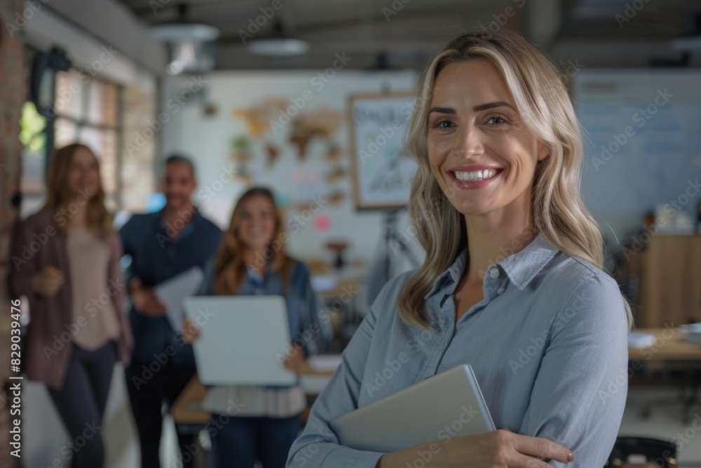Confident business leader with team in office meeting. Confident business leader with team in office meeting.