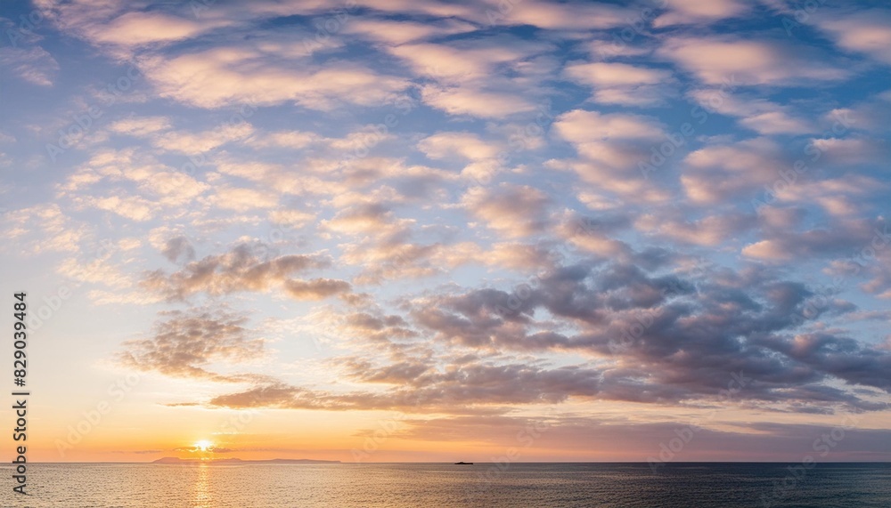 amazing panoramic sunrise or sunset sky with gentle colorful clouds