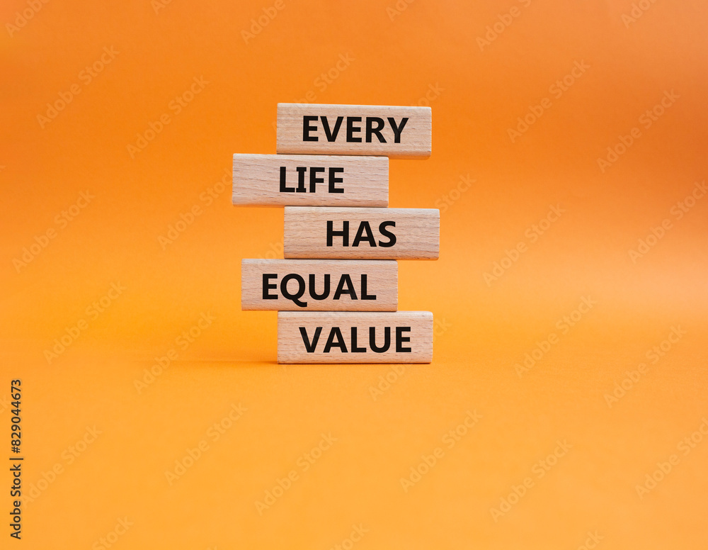 Naklejka premium Equality symbol. Wooden blocks with words Every Life has Equal Value. Beautiful orange background. Equality and life concept. Copy space.