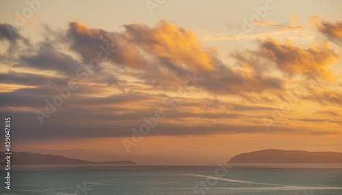 calming cloud background with soft orange glow of a tranquil sunset