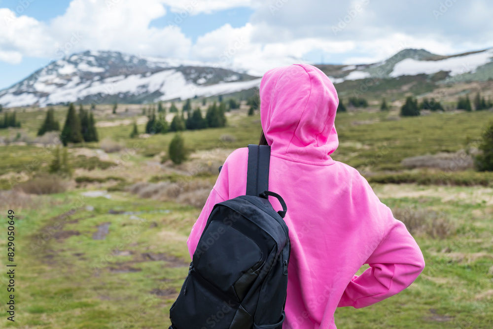 Traveler Woman standing in the spring mountain .Vitosha Mountain ,Bulgaria Traveler Woman standing in the spring mountain .Vitosha Mountain ,Bulgaria