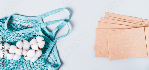 Refusal of plastic bags, string bag, cotton branch and paper bags on blue web banner