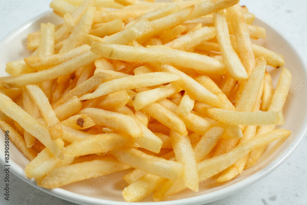 A closeup view of a bowl of French fries. A closeup view of a bowl of French fries.