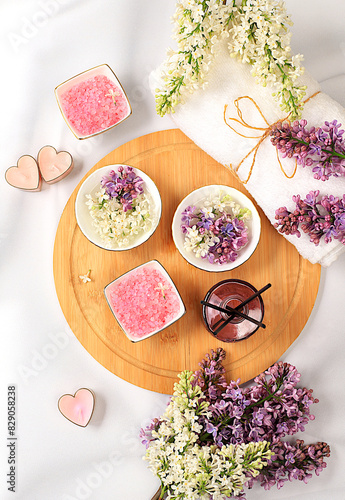 Fragrant pink salt, lilac water and lilac flowers. Spa and wellness composition, aromatherapy and skin care, lifestyle and organic cosmetics concept, salon invitation and advertisement, 