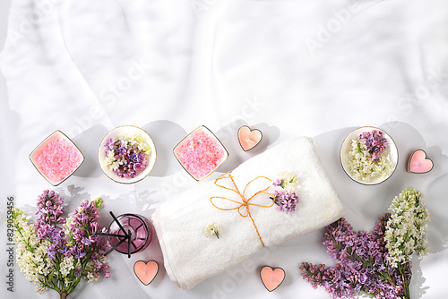 Fragrant pink salt, lilac water and lilac flowers. Spa and wellness composition, aromatherapy and skin care, lifestyle and organic cosmetics concept, salon invitation and advertisement, 