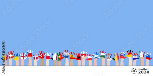 Concept of  football cup 2024. Raised hands of football fans, whose palms are painted with the flags of the countries participating in the championship. Community. Footer with soccer ball and text spa
