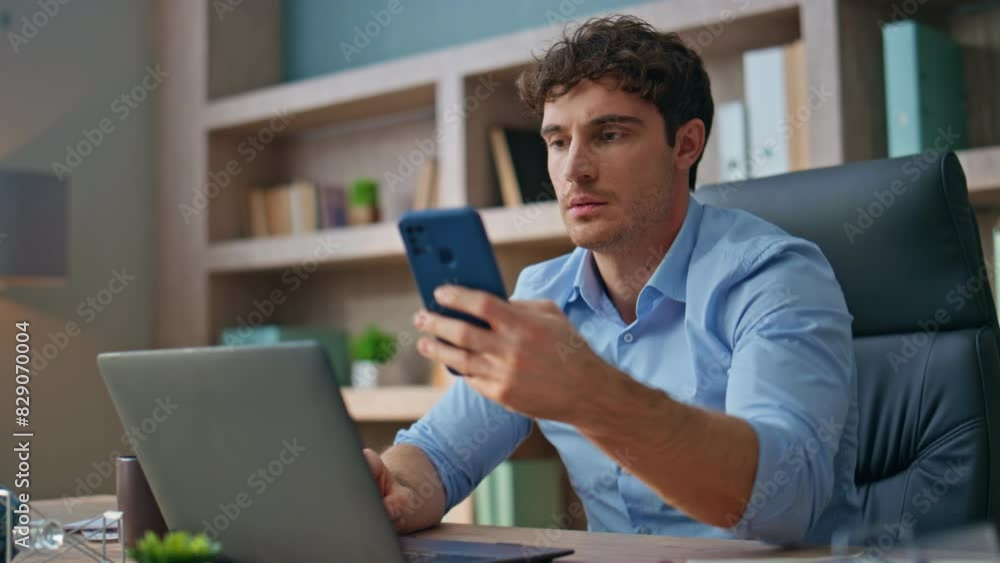 Frustrated employee reading mobile phone message. Closeup emotional boss receive Frustrated employee reading mobile phone message. Closeup emotional boss receive