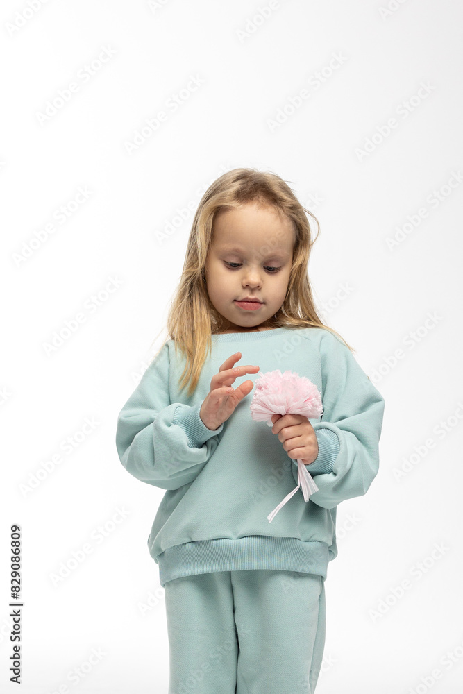 Portrait of beautiful cute little toddler girl. Child with funny face in mint sweatshirt. Pretty smile kid in studio on white background. High quality photo Portrait of beautiful cute little toddler girl. Child with funny face in mint sweatshirt. Pretty smile kid in studio on white background. High quality photo