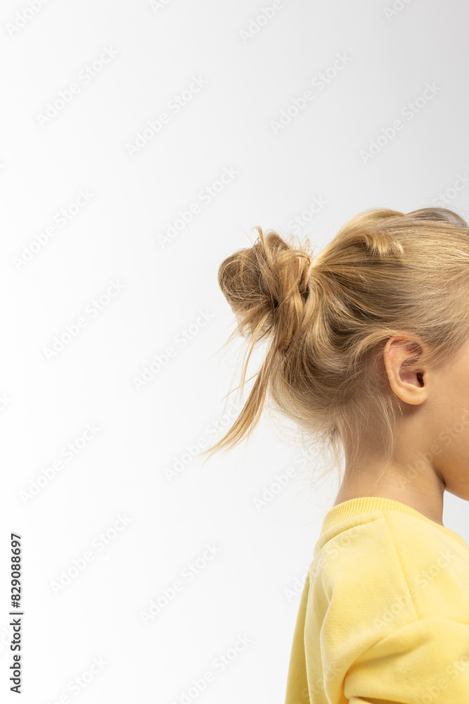 Portrait of beautiful cute little toddler girl. Child with funny face in yellow sweatshirt. Pretty smile kid in studio on white background. High quality photo Portrait of beautiful cute little toddler girl. Child with funny face in yellow sweatshirt. Pretty smile kid in studio on white background. High quality photo