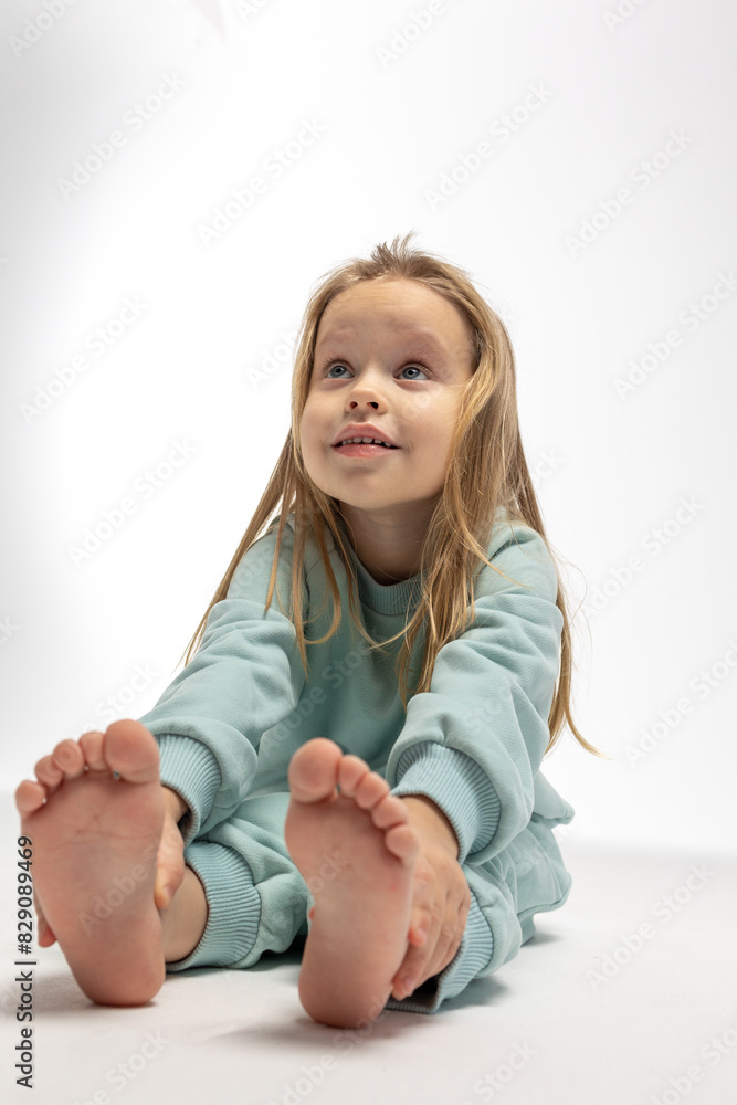 Portrait of beautiful cute little toddler girl. Child with funny face. Pretty smile kid in studio on white background. High quality photo Portrait of beautiful cute little toddler girl. Child with funny face. Pretty smile kid in studio on white background. High quality photo