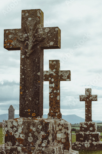 Stone Crosses on tombs in a cemetery, Cahir, County Tipperary, Ireland photo