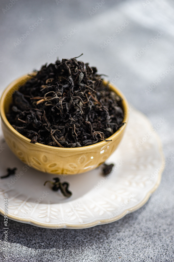 Close-up of a Ceramic bowl filled with loose leaf tea on a table Close-up of a Ceramic bowl filled with loose leaf tea on a table