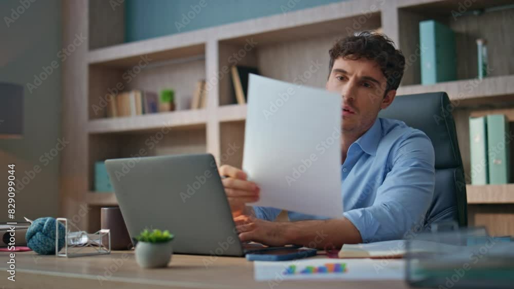 Tired manager solving problem in contemporary office. Stressed man throw papers Tired manager solving problem in contemporary office. Stressed man throw papers