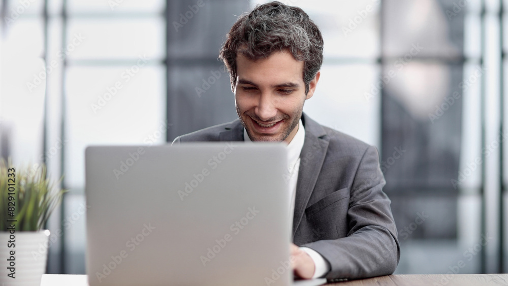 Successful businessman working inside office, man in business suit Successful businessman working inside office, man in business suit