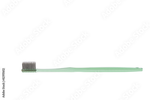 Green toothbrush on white background